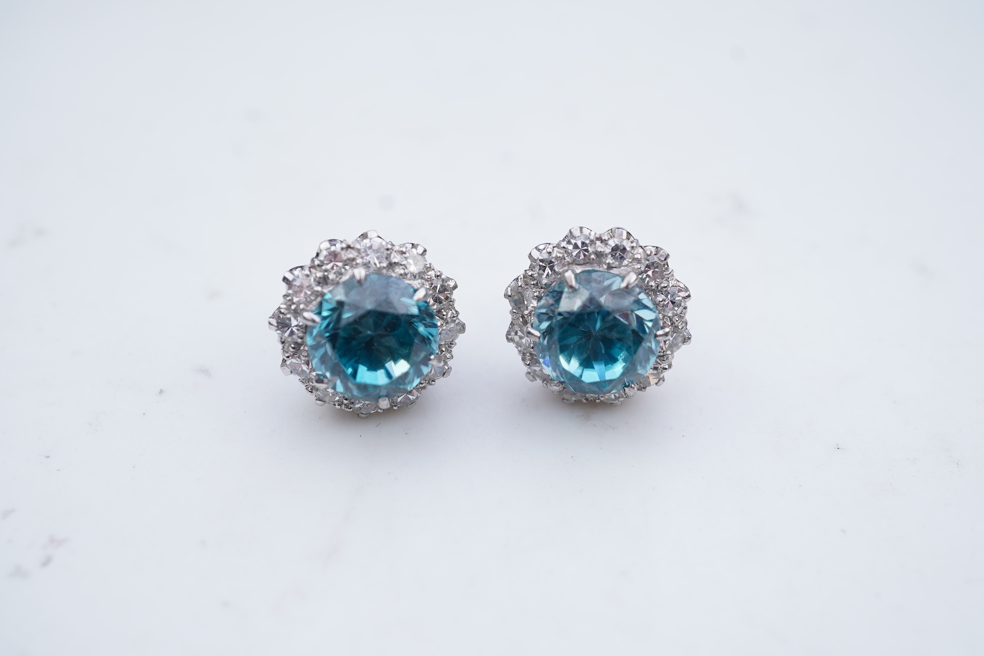 A pair of zircon and diamond earrings, mid 20th century